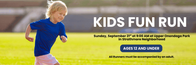 Child running on the track for the Kids Fun Run.