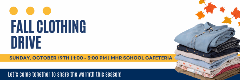 A stack of clothes folded with fall leaves in the corner.